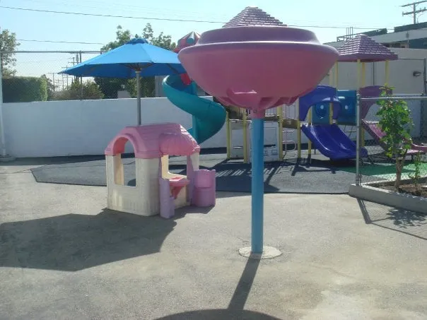 Kids Planet Glendale outdoor play area with shade and play structures