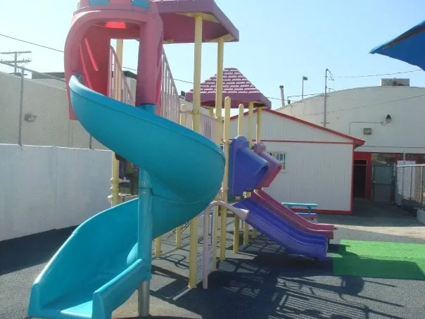 Outdoor playground slide structure at Kids Planet Glendale